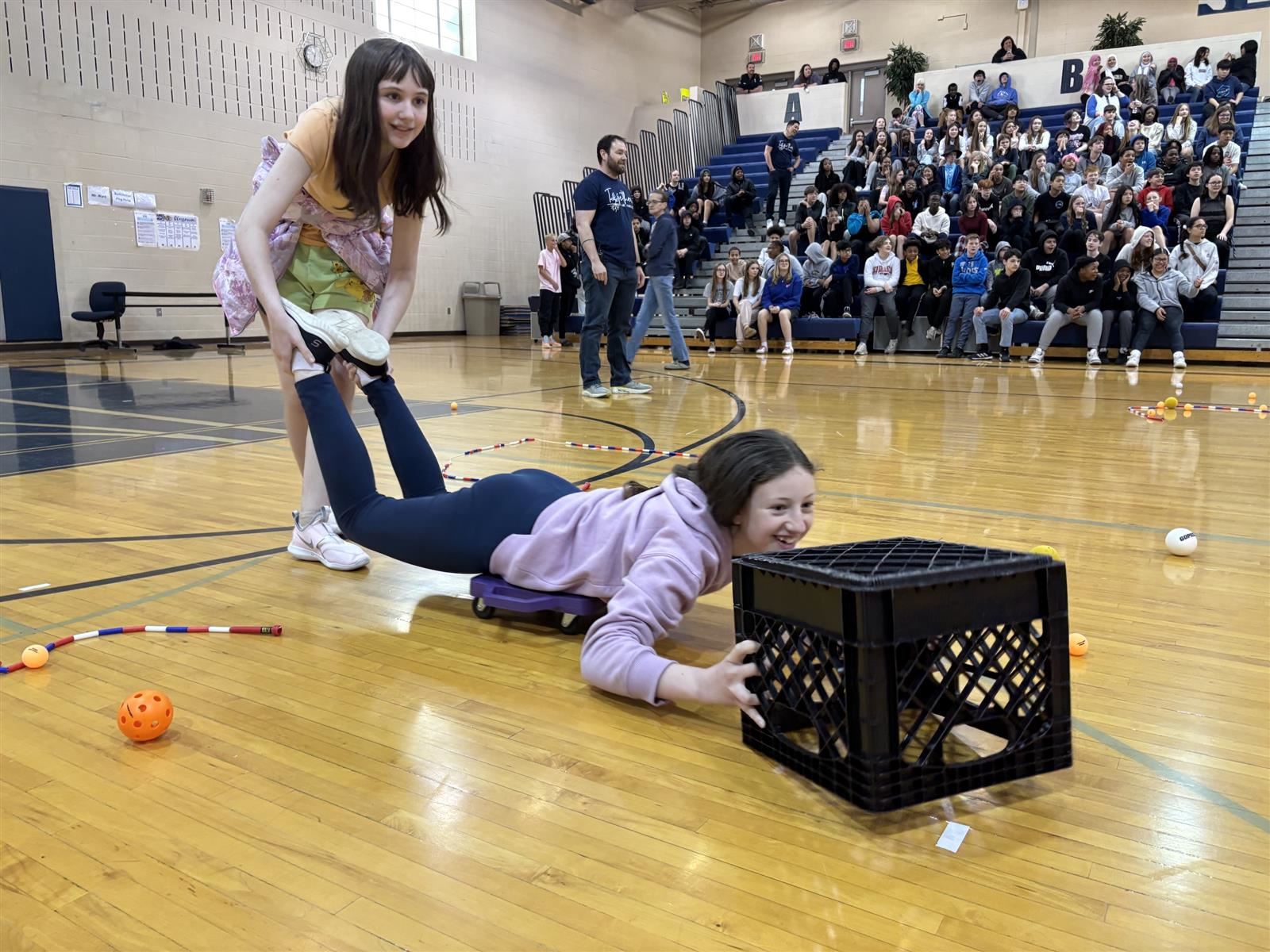  two students play hungry hungry hippo
